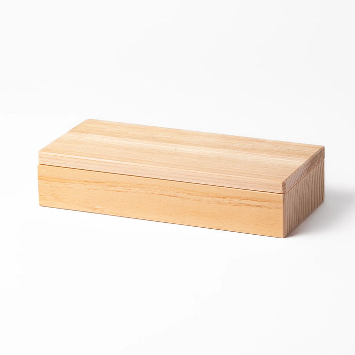 Hinoki wood onigiri mold with two triangle cavities and a matching lid, perfect for shaping traditional Japanese rice balls with ease and aroma.
