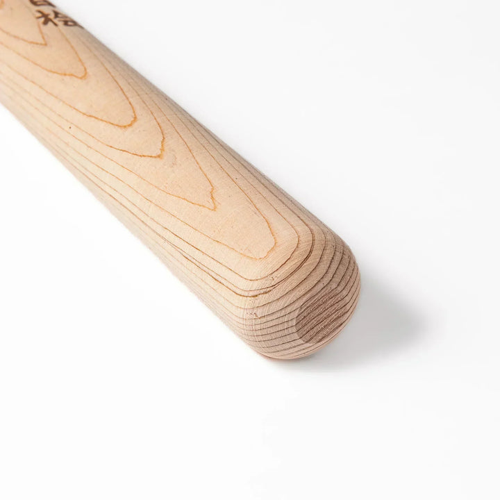 Hinoki wood pestle with engraved Japanese characters and hanging cord, crafted for use with suribachi mortars to grind seeds and spices smoothly.