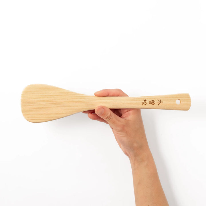 Lightweight spatula made from natural hinoki wood, featuring fine vertical grain and engraved Japanese characters on the handle for an authentic touch.