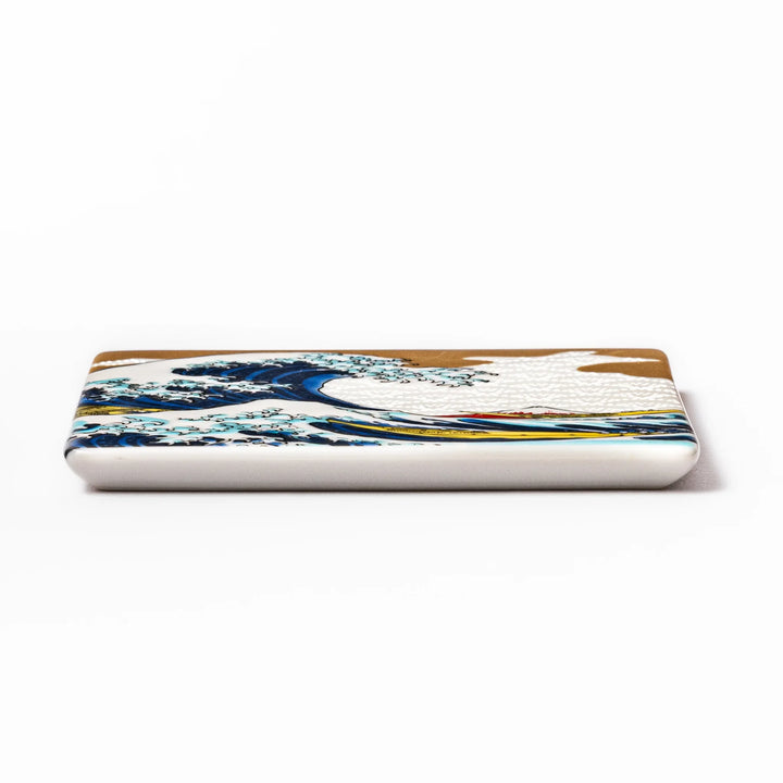 Square Japanese ceramic coaster featuring Hokusai’s Great Wave design with dramatic blue waves, golden sky, and Mt. Fuji, bringing iconic art to dining tables.