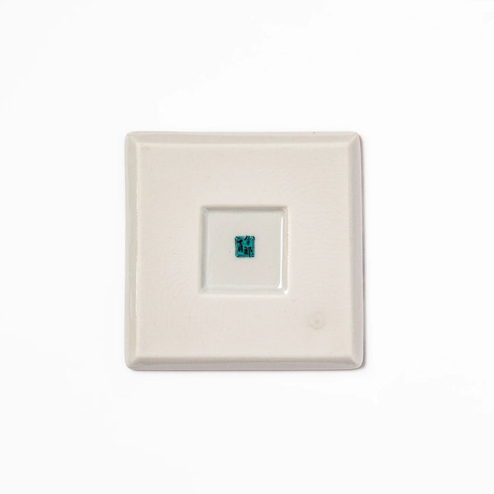 Square Japanese ceramic coaster featuring Hokusai’s Great Wave design with dramatic blue waves, golden sky, and Mt. Fuji, bringing iconic art to dining tables.