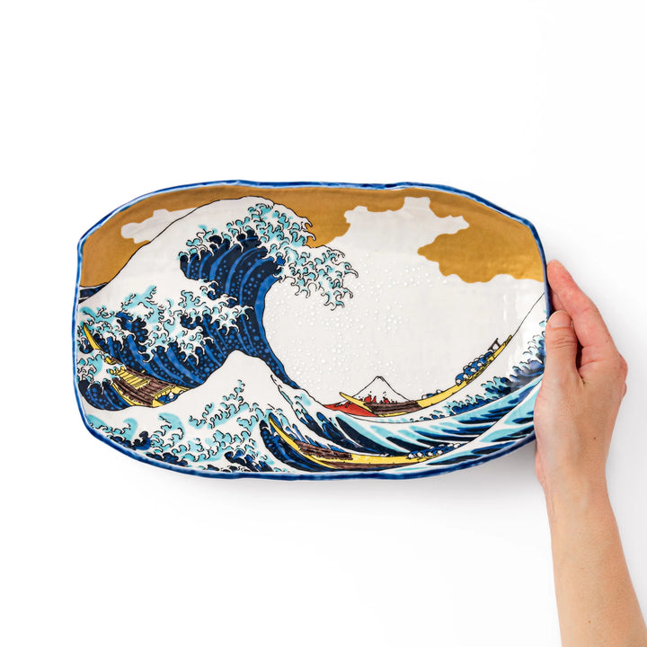 Rectangular serving plate featuring Hokusai’s Great Wave off Kanagawa, highlighted with vivid blue, gold, and white for a striking presentation.