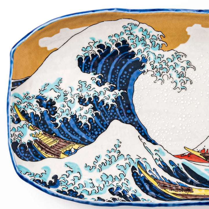 Rectangular serving plate featuring Hokusai’s Great Wave off Kanagawa, highlighted with vivid blue, gold, and white for a striking presentation.