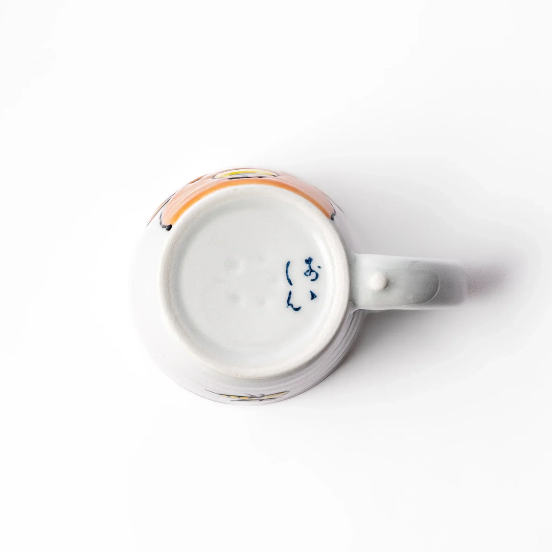 White ceramic kids mug featuring friendly honey bear face, yellow interior, round handle, shown on white background