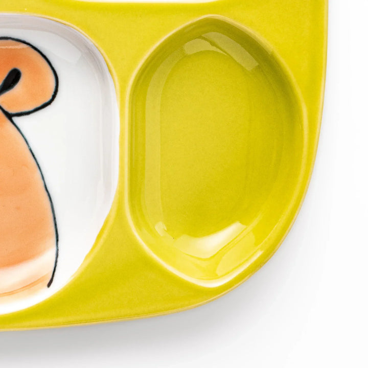 White ceramic kids plate with honey bear face in main section, bee motif in small section, chartreuse accents