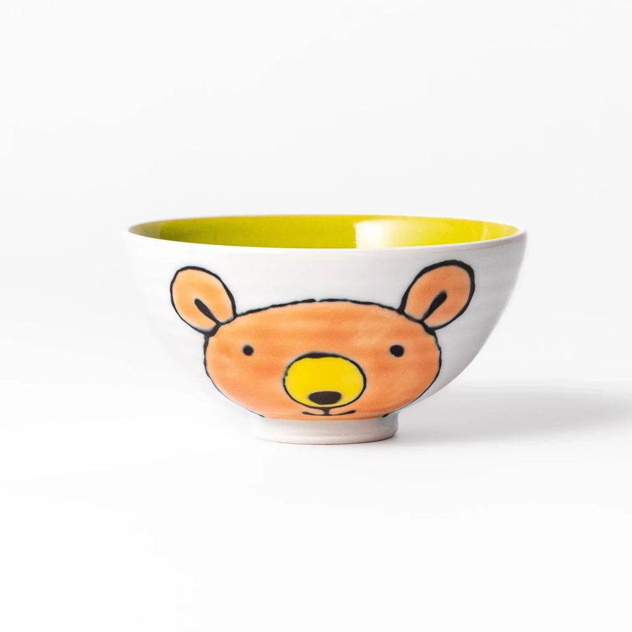 White ceramic kids rice bowl featuring honey bear face, chartreuse interior, round footed base