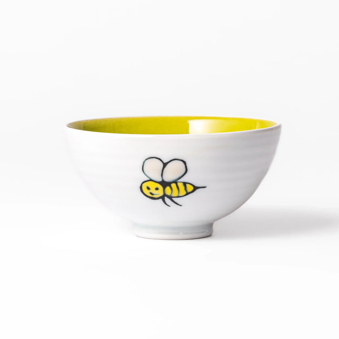 White ceramic kids rice bowl featuring honey bear face, chartreuse interior, round footed base