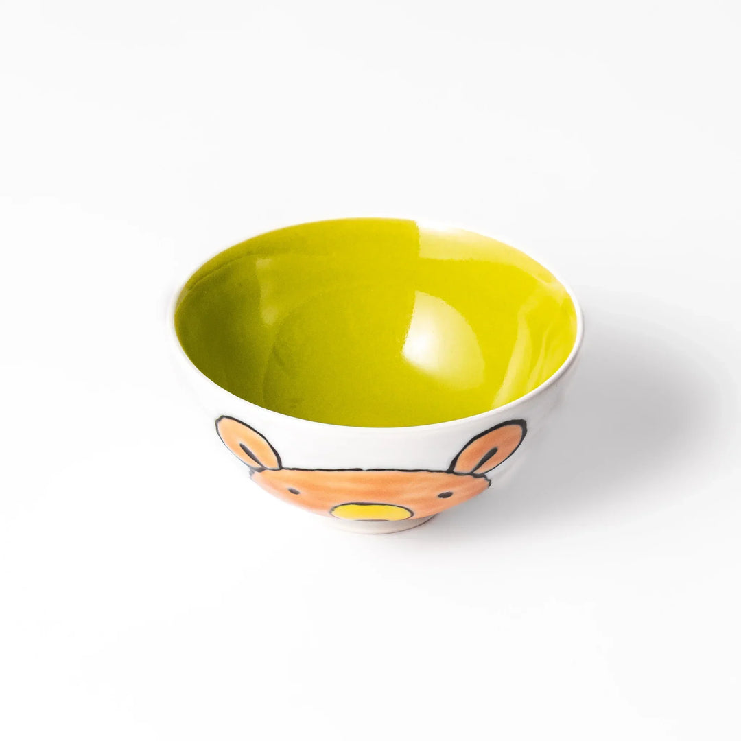 White ceramic kids rice bowl featuring honey bear face, chartreuse interior, round footed base