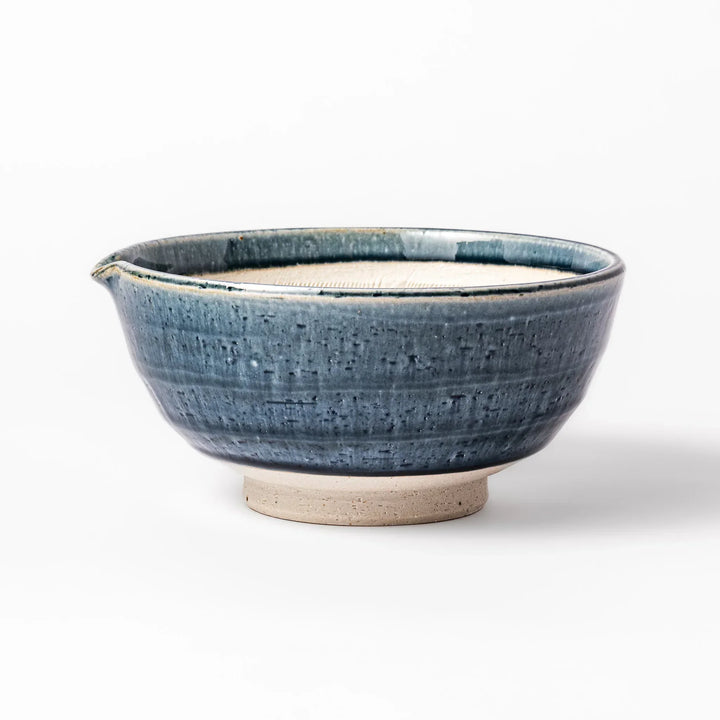 Indigo glaze Japanese suribachi mortar with cream-colored grooved interior and pouring spout, ideal for grinding sesame seeds, herbs, and spices.