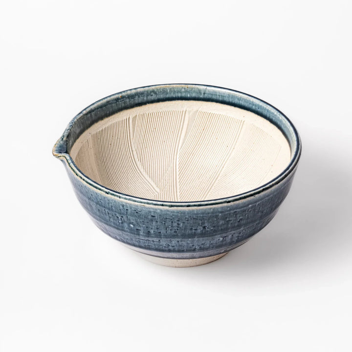 Indigo glaze Japanese suribachi mortar with cream-colored grooved interior and pouring spout, ideal for grinding sesame seeds, herbs, and spices.