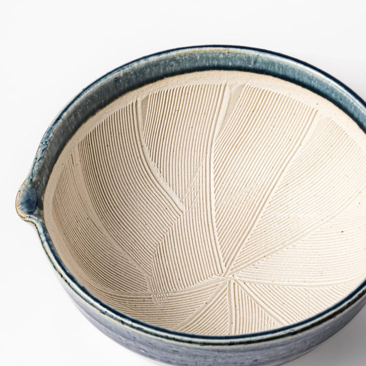Indigo glaze Japanese suribachi mortar with cream-colored grooved interior and pouring spout, ideal for grinding sesame seeds, herbs, and spices.