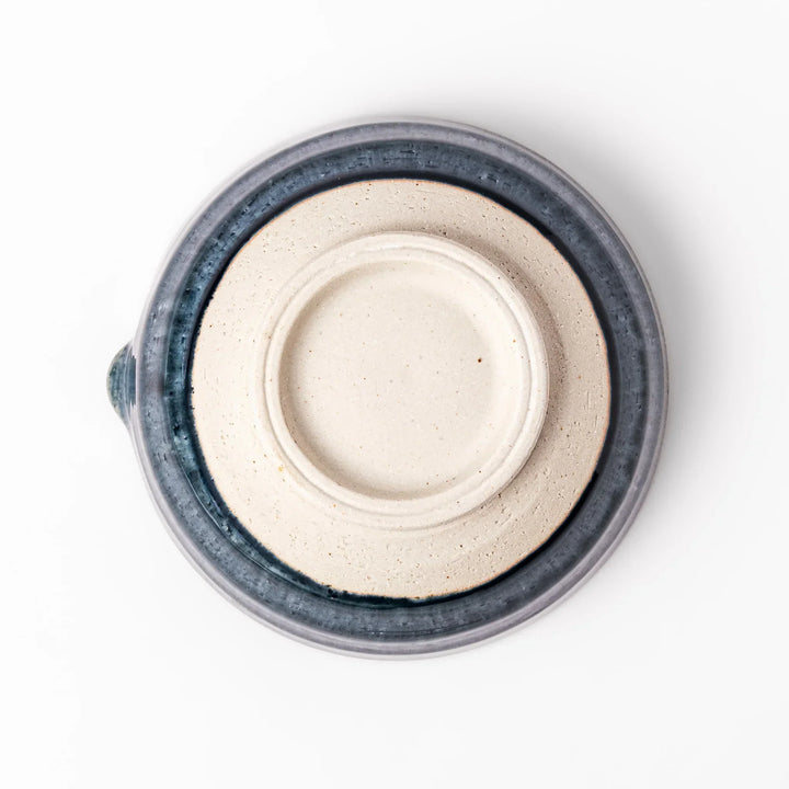 Indigo glaze Japanese suribachi mortar with cream-colored grooved interior and pouring spout, ideal for grinding sesame seeds, herbs, and spices.