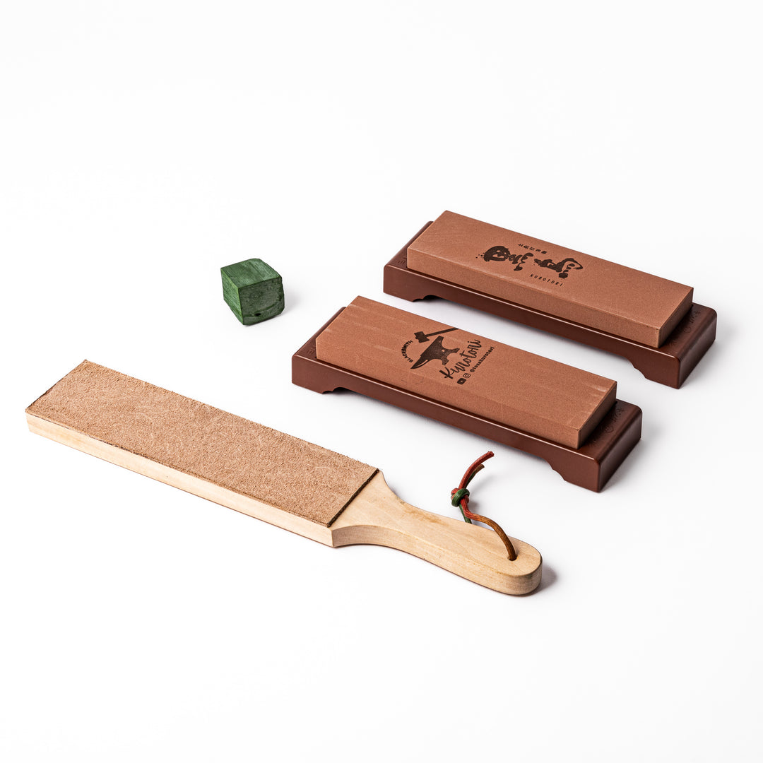 Japanese knife maintenance kit with whetstones leather strop and polishing compound designed for sharpening and honing blades.