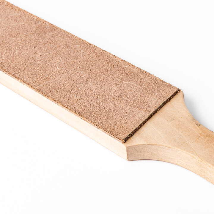 Japanese knife maintenance kit with whetstones leather strop and polishing compound designed for sharpening and honing blades.