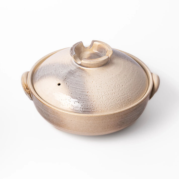Japanese donabe clay pot with misty beige glazed lid and handles, family-size design ideal for hot pot and slow cooking meals.