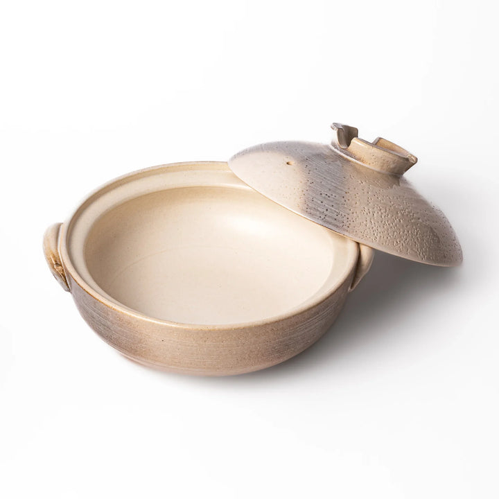 Japanese donabe clay pot with misty beige glazed lid and handles, family-size design ideal for hot pot and slow cooking meals.
