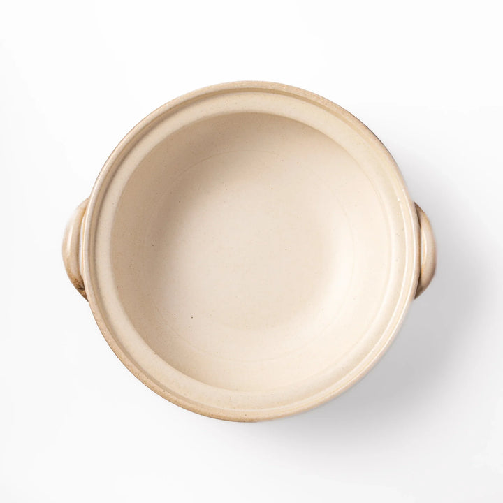 Japanese donabe clay pot with misty beige glazed lid and handles, family-size design ideal for hot pot and slow cooking meals.