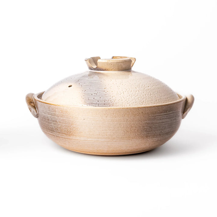 Japanese donabe clay pot with misty beige glazed lid and handles, family-size design ideal for hot pot and slow cooking meals.