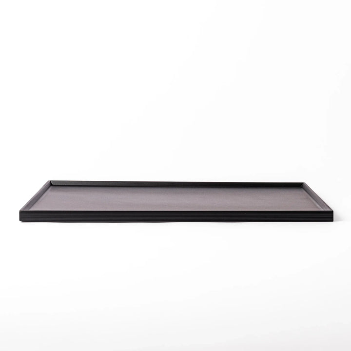 Modern Japanese Lacquer Serving Tray in sleek black with a textured horizontal grain pattern and subtle side grooves for easy handling.