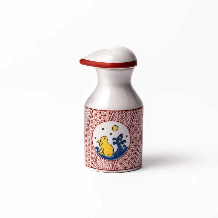 Japanese ceramic soy sauce dispenser with a red geometric pattern and moon rabbit motif, blending tradition and charm for an elegant dining table accent.