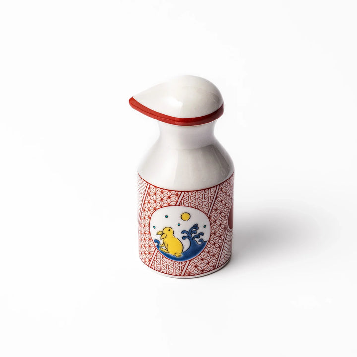 Japanese ceramic soy sauce dispenser with a red geometric pattern and moon rabbit motif, blending tradition and charm for an elegant dining table accent.