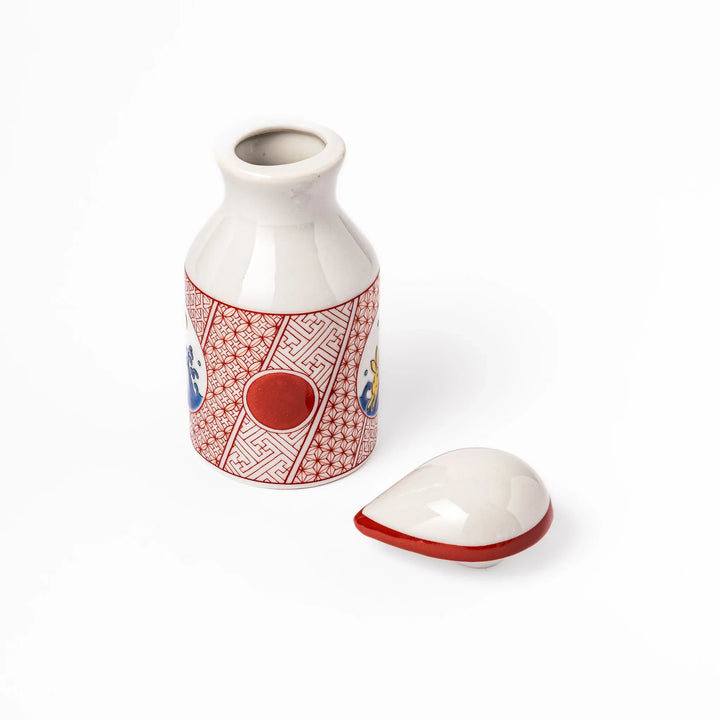 Japanese ceramic soy sauce dispenser with a red geometric pattern and moon rabbit motif, blending tradition and charm for an elegant dining table accent.