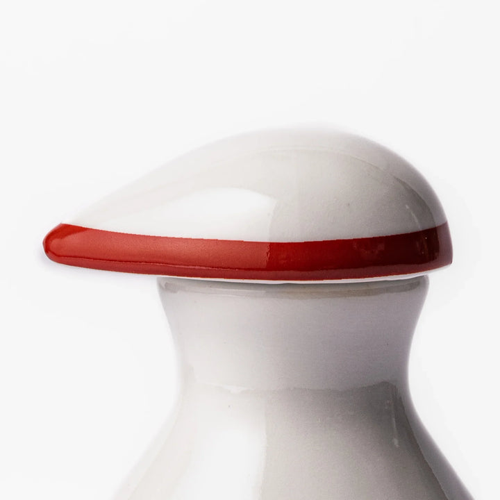 Japanese ceramic soy sauce dispenser with a red geometric pattern and moon rabbit motif, blending tradition and charm for an elegant dining table accent.