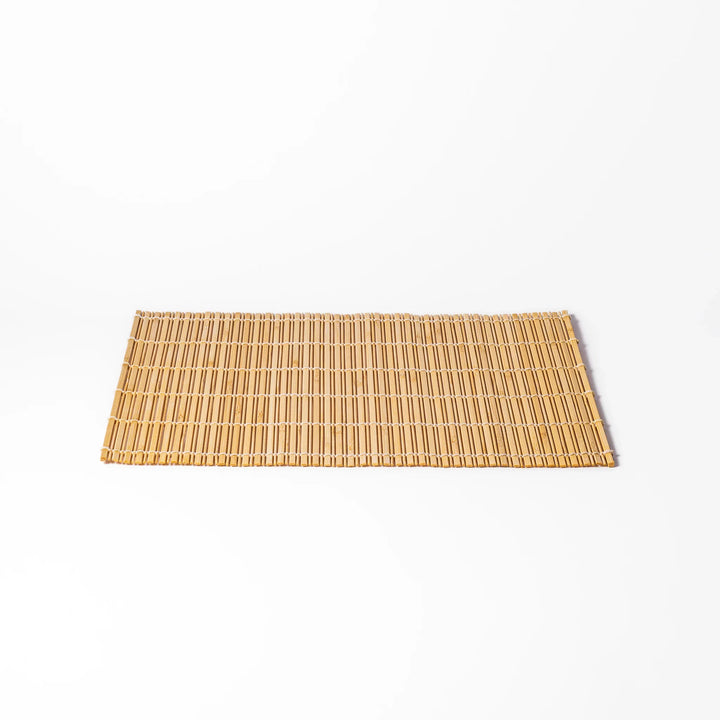 Natural finish bamboo table mat with slim vertical slats and white cord binding, offering a clean, earthy touch to traditional Japanese table settings.