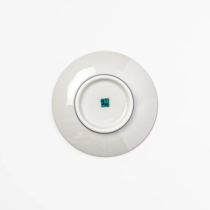 Round Japanese ceramic sauce dish with a deep blue background decorated with playful Shiba Inu dogs, paw prints, and bones, perfect for condiments or snacks.