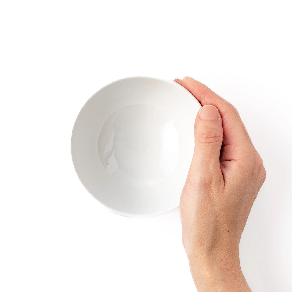 White ceramic kids rice bowl featuring red fire truck graphic, round footed base, shown on white background
