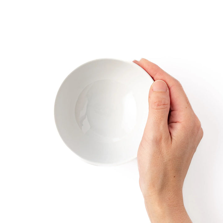 White ceramic kids rice bowl featuring red fire truck graphic, round footed base, shown on white background
