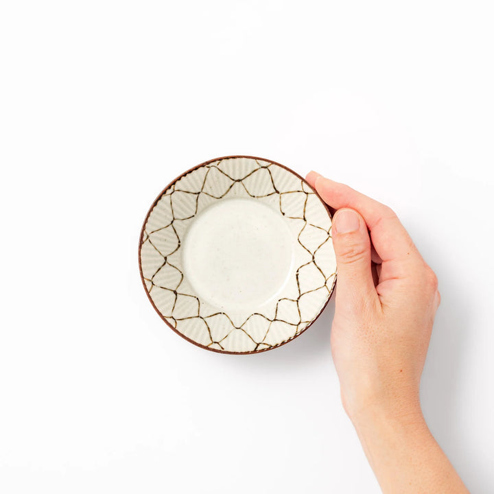 Japanese ceramic dessert bowl with rustic diamond weave pattern and earthy brown rim, ideal for serving sweets or side dishes
