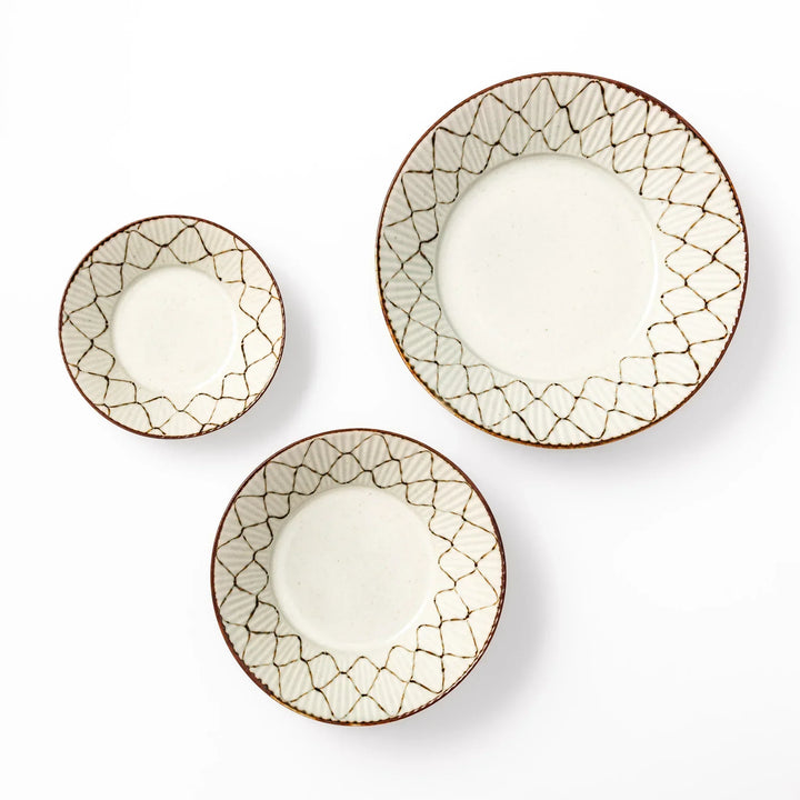 Set of three Japanese ceramic bowls with rustic diamond weave pattern and earthy rim, perfect for modern dining