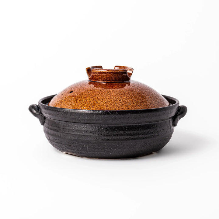 Japanese donabe clay pot with rustic brown glazed lid and black base, induction compatible and ideal for 2–3 person hot pot meals