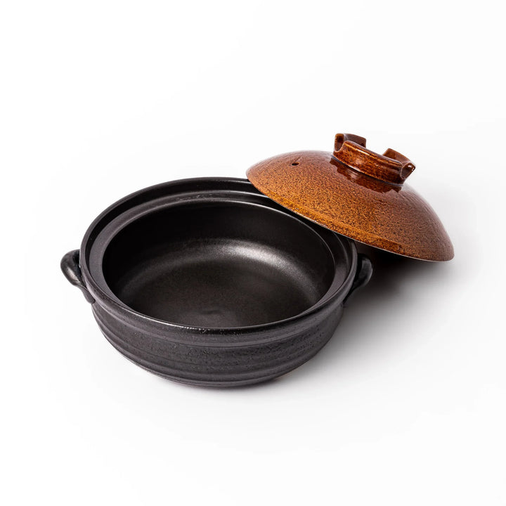 Japanese donabe clay pot with rustic brown glazed lid and black base, induction compatible and ideal for 2–3 person hot pot meals