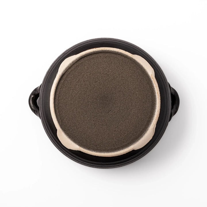Japanese donabe clay pot with rustic brown glazed lid and black base, induction compatible and ideal for 2–3 person hot pot meals