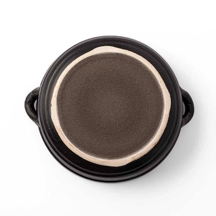 Japanese donabe clay pot with rustic brown glazed lid and black base, induction compatible and perfect for family hot pot meals.
