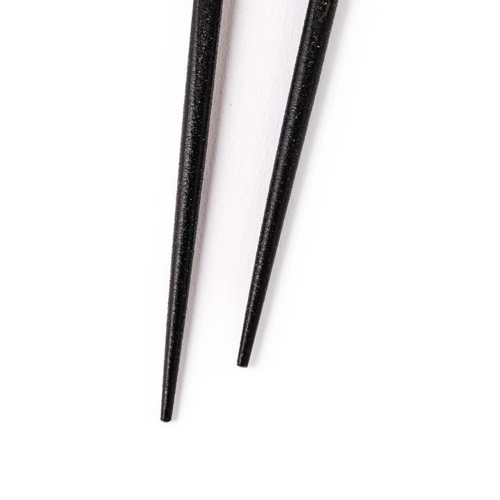 Japanese black lacquer chopsticks with shimmering abalone shell inlay, handcrafted for refined and elegant dining.