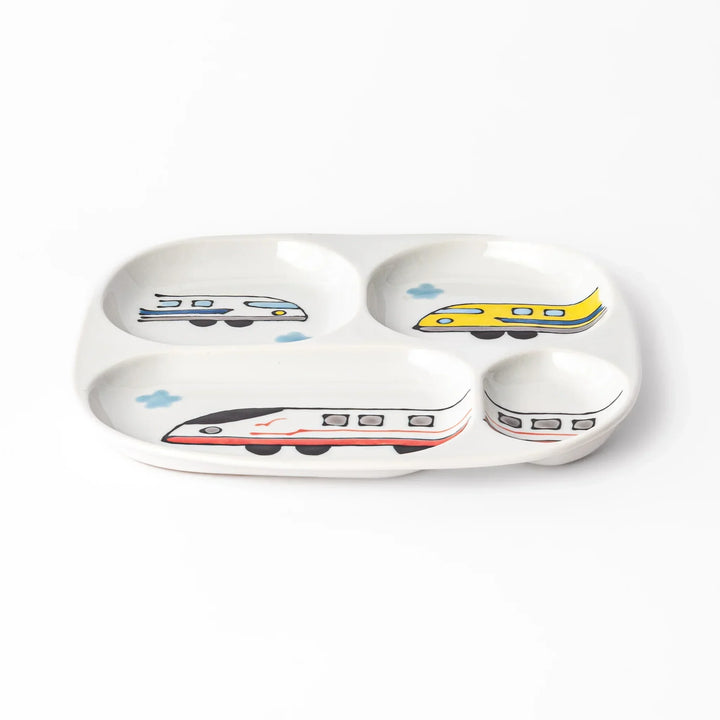 White ceramic kids plate with red, white and yellow Shinkansen train motifs in sections, accented by blue cloud details