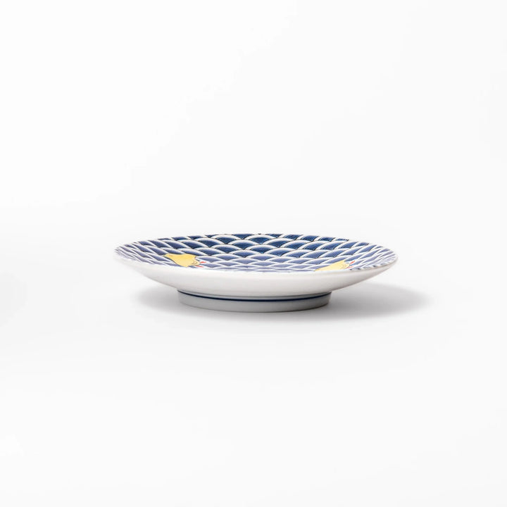 Round Japanese ceramic sauce dish with traditional blue wave pattern and playful yellow shorebirds, perfect for serving soy sauce, condiments, or appetizers.