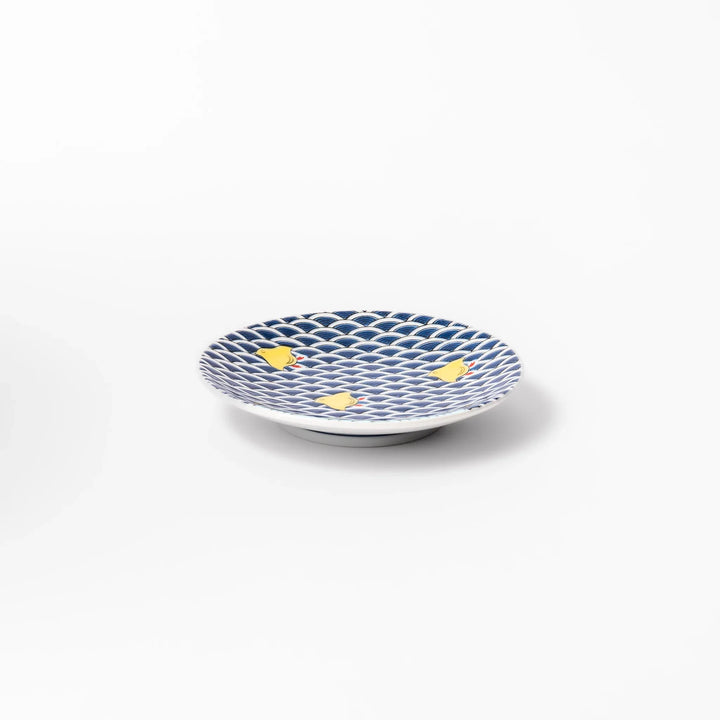 Round Japanese ceramic sauce dish with traditional blue wave pattern and playful yellow shorebirds, perfect for serving soy sauce, condiments, or appetizers.