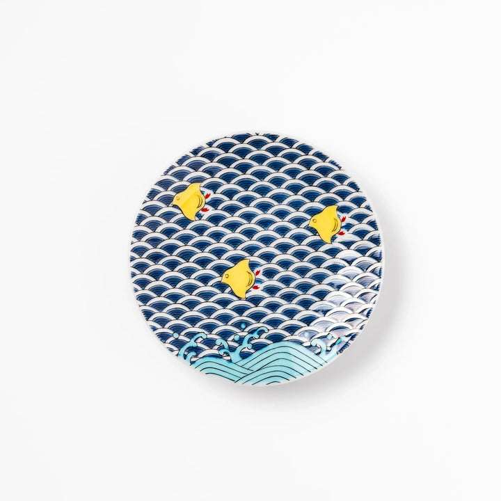 Round Japanese ceramic sauce dish with traditional blue wave pattern and playful yellow shorebirds, perfect for serving soy sauce, condiments, or appetizers.