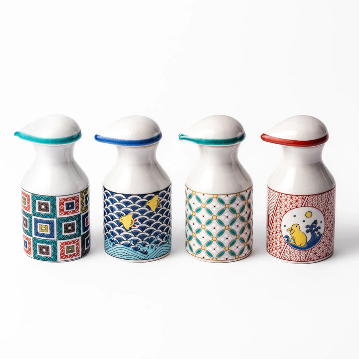 Set of Japanese ceramic soy sauce dispensers with colorful patterns including waves, shorebirds, and geometric motifs, perfect for enhancing dining tables.