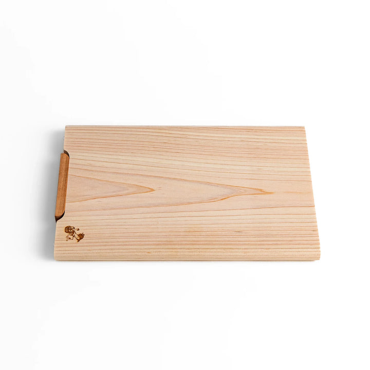 Small Hinoki wood cutting board with smooth grain, natural finish, corner handle, and engraved motif, crafted in Japan
