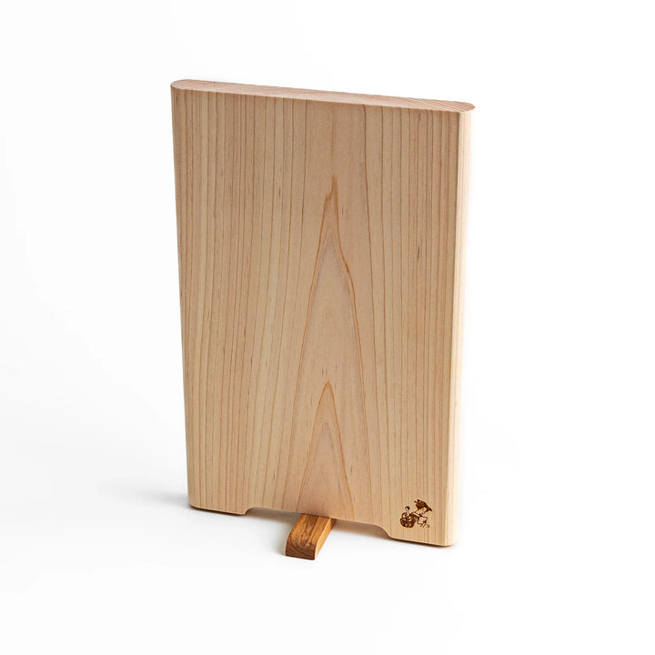 Small Hinoki wood cutting board with smooth grain, natural finish, corner handle, and engraved motif, crafted in Japan