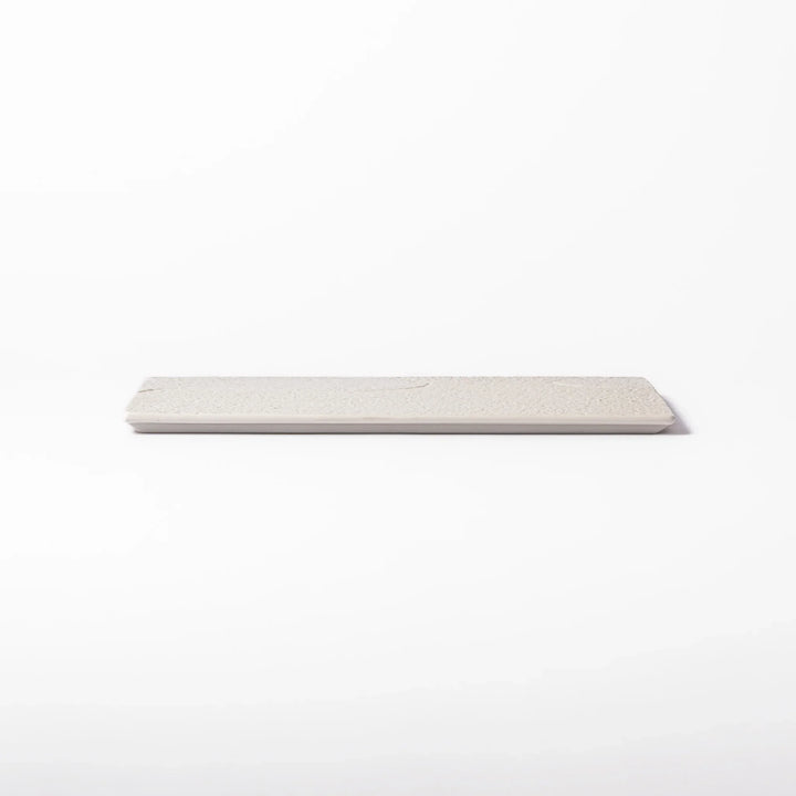 Textured white ceramic dinner plate with subtle ridged lines and matte-gloss contrast, perfect for refined Japanese dining and elegant plating.