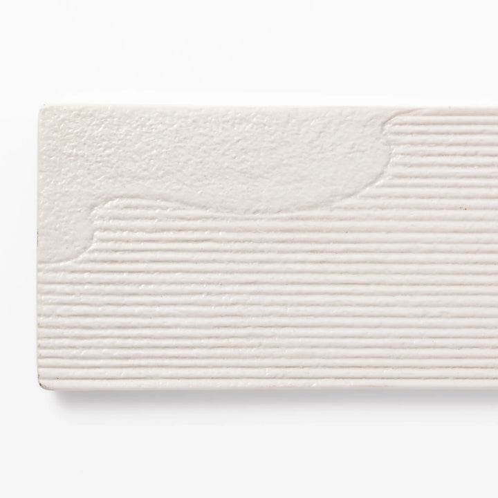 Rectangular white ceramic serving plate with fine ridged texture and soft matte-gloss contrast, ideal for modern Japanese table presentations.