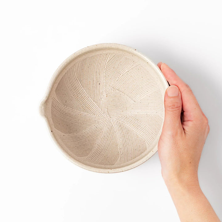 Soft sage-colored mortar with a speckled Hiwa glaze and grooved interior, perfect for grinding sesame or spices.