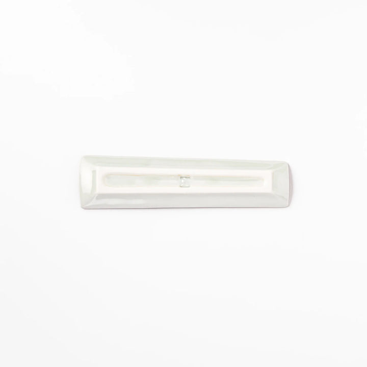 Japanese porcelain chopstick rest with whimsical China design featuring red pagoda, pandas, bamboo, and green tree accents