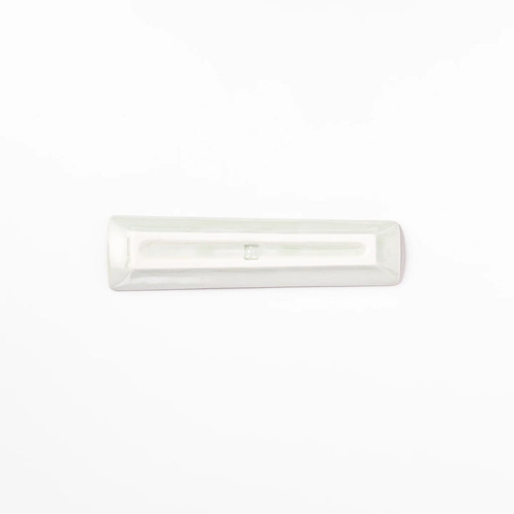 Japanese porcelain chopstick rest with whimsical Egypt design featuring pyramid, camel, cactus, and colorful palm trees